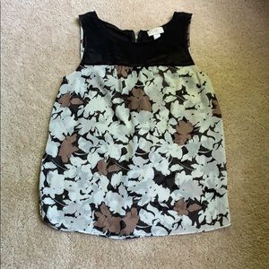 Black, tan and white sleeveless blouse
